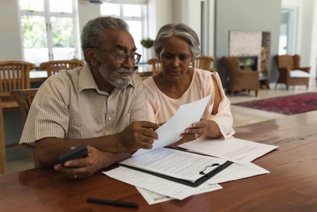 Man and woman looking over documents